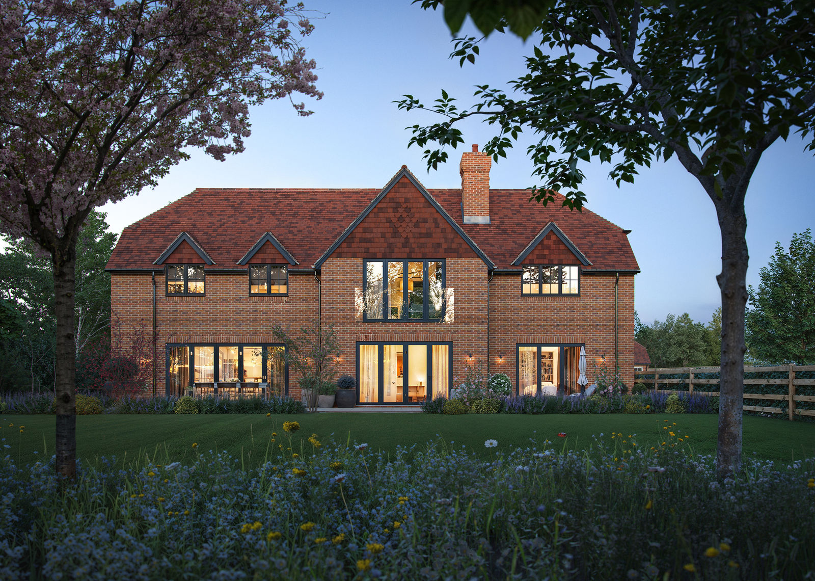 Garden elevation at dusk with lit interiors